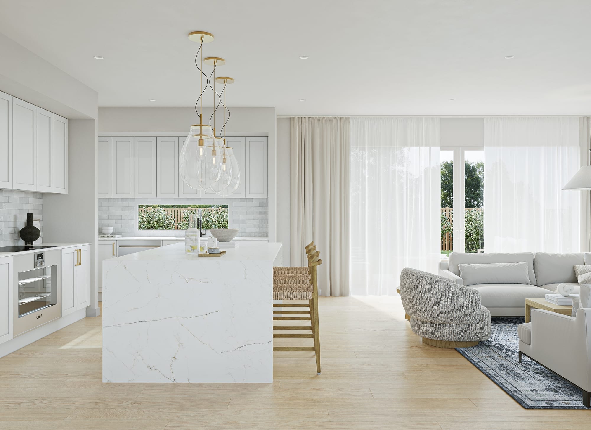 Open-plan kitchen and living with a marble-look stone island, glass pendants and sheer-curtained sliding doors to the garden