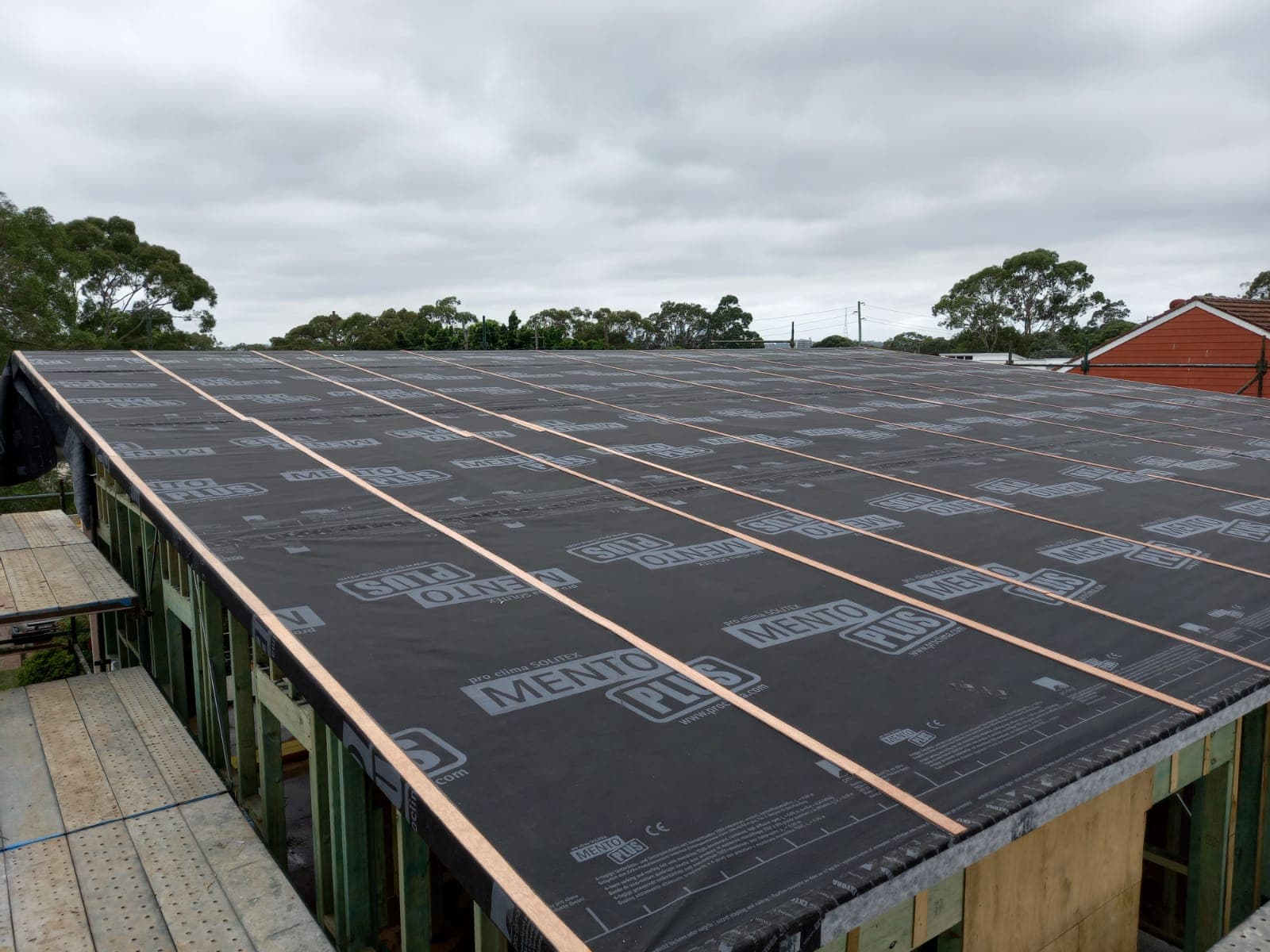 Continuous roof membrane wrap on a Marvel Homes passive house under construction