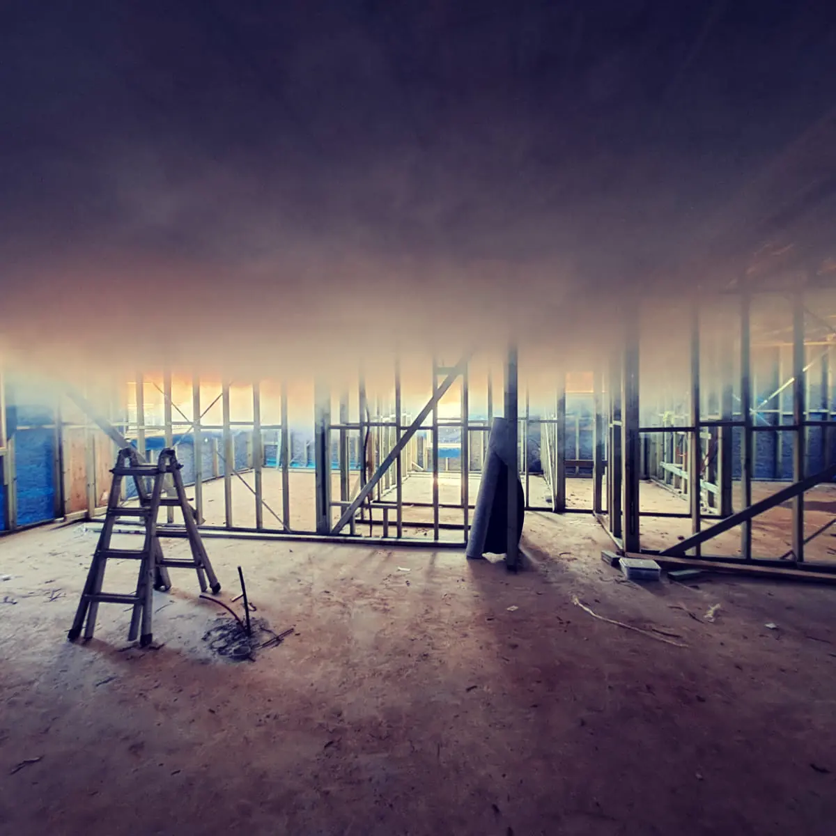 Smoke drifting through a timber frame during an air-leak detection test on a Marvel Homes site