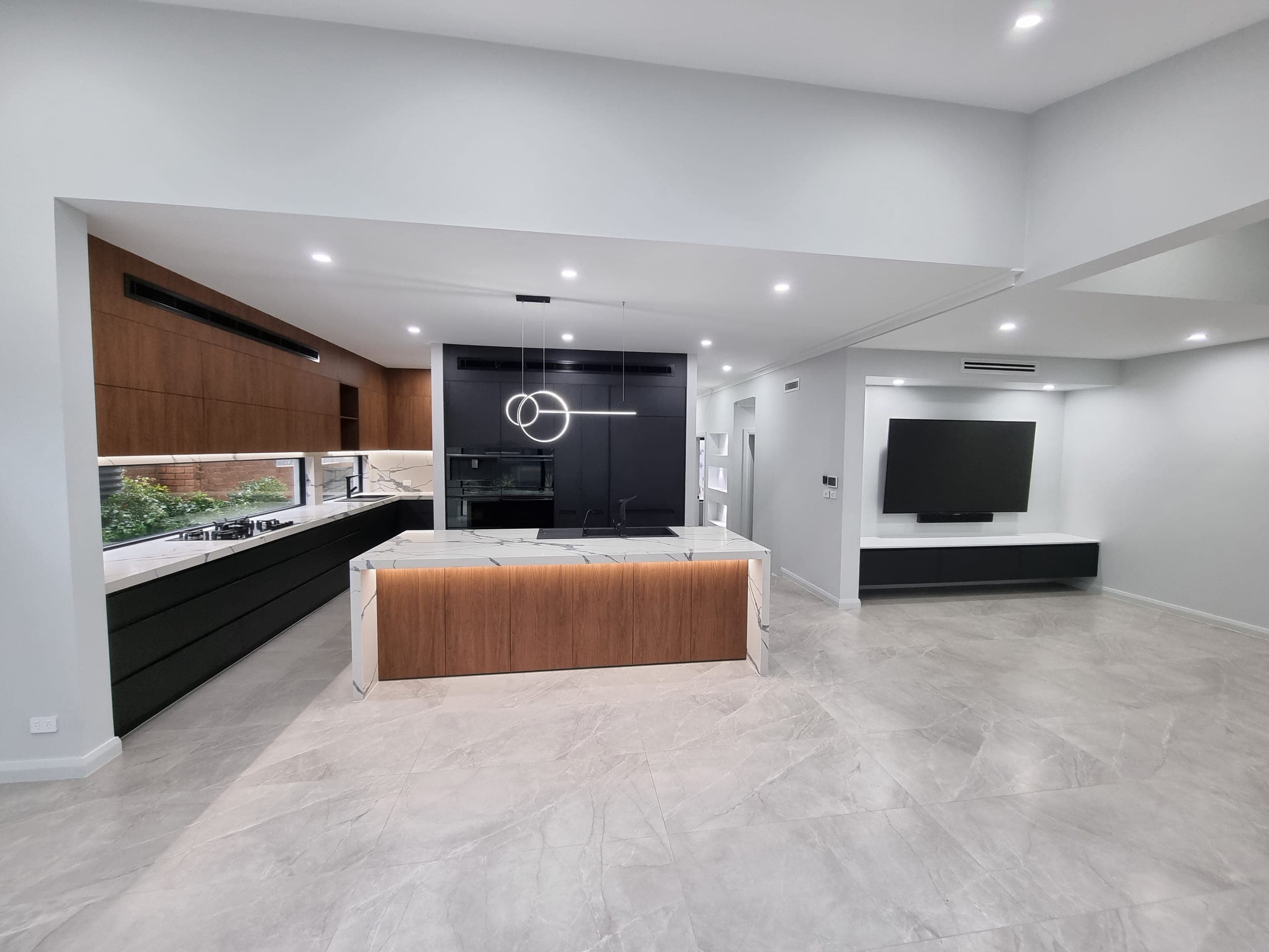 Open-plan kitchen and living in the Pennant Hills custom home, Sydney