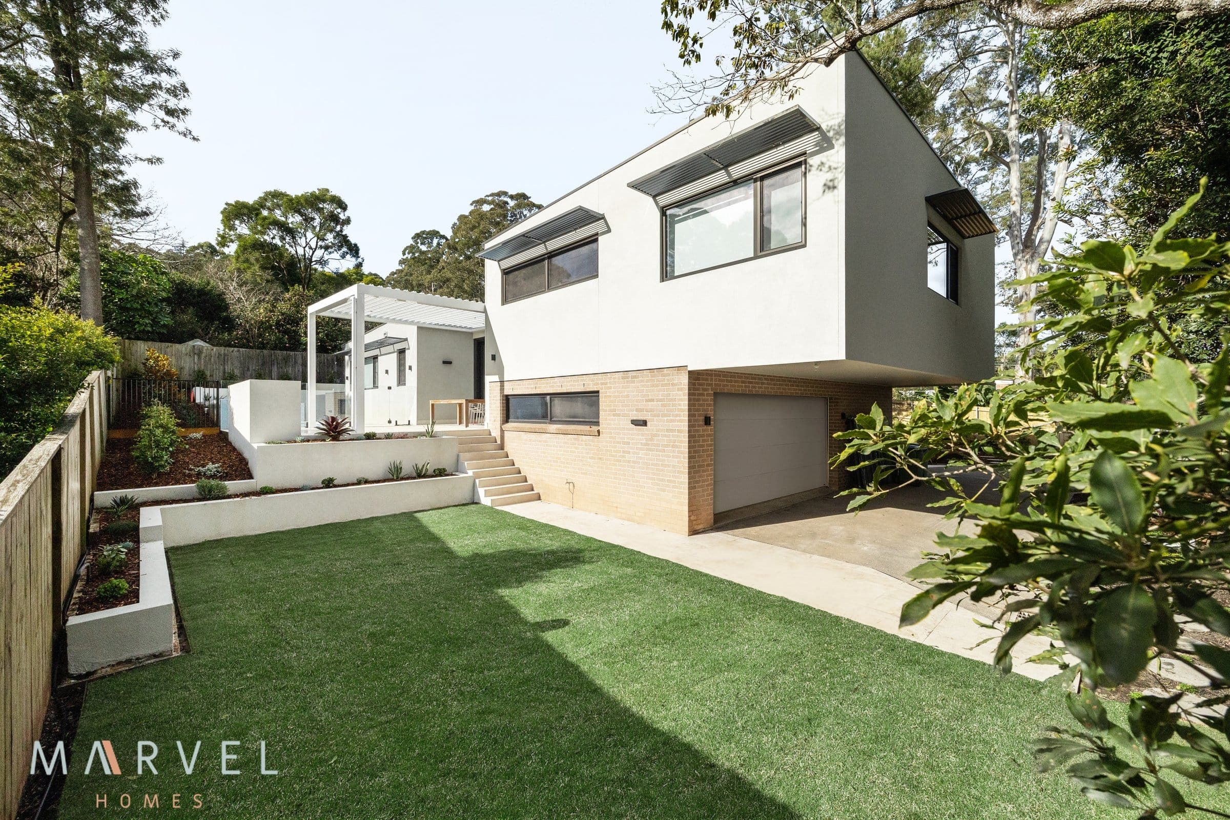 Warrawee rear garden and the home on its sloping block