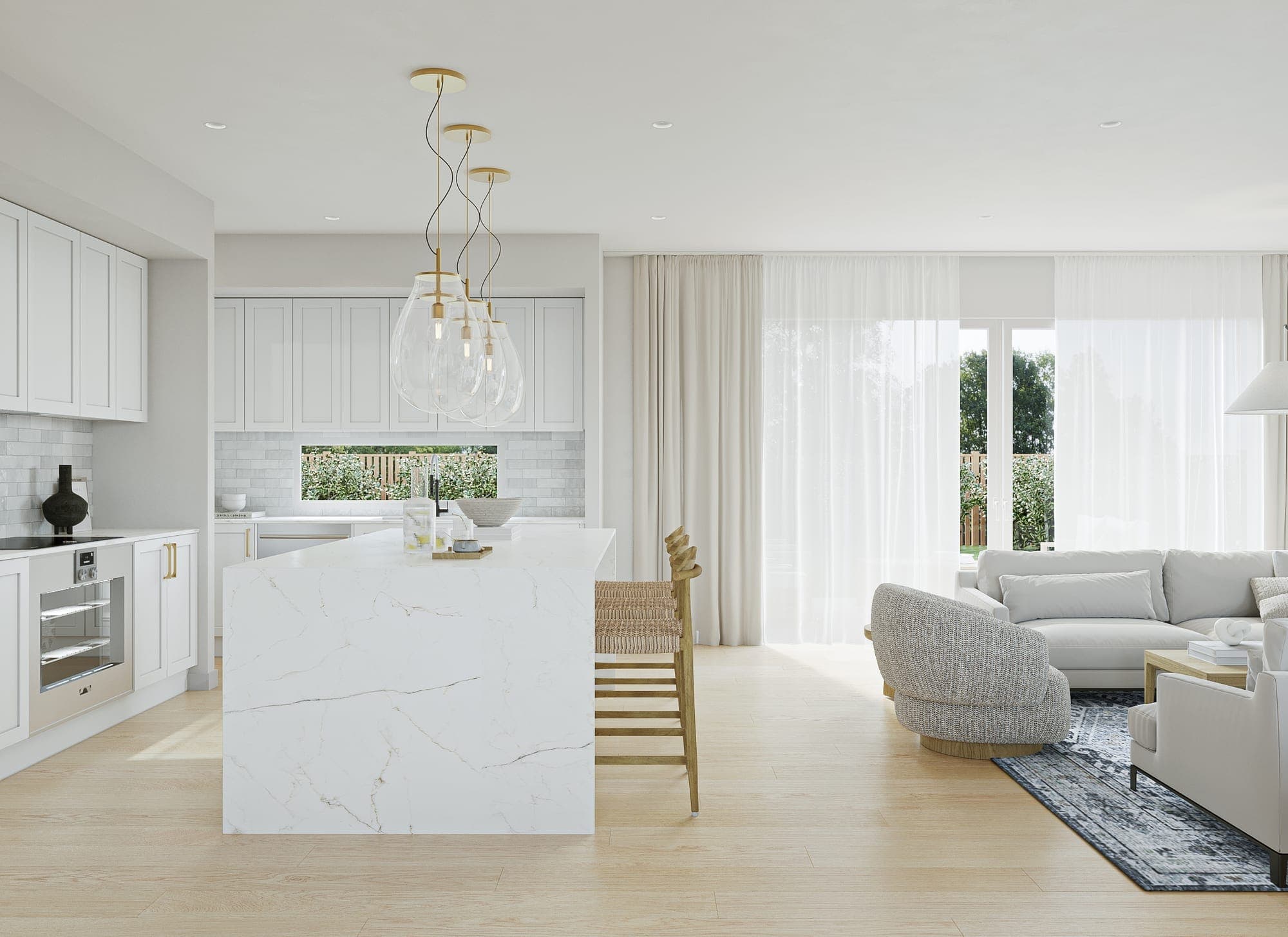 Open-plan kitchen and living with a marble-look stone island, glass pendants and sheer-curtained sliding doors to the garden