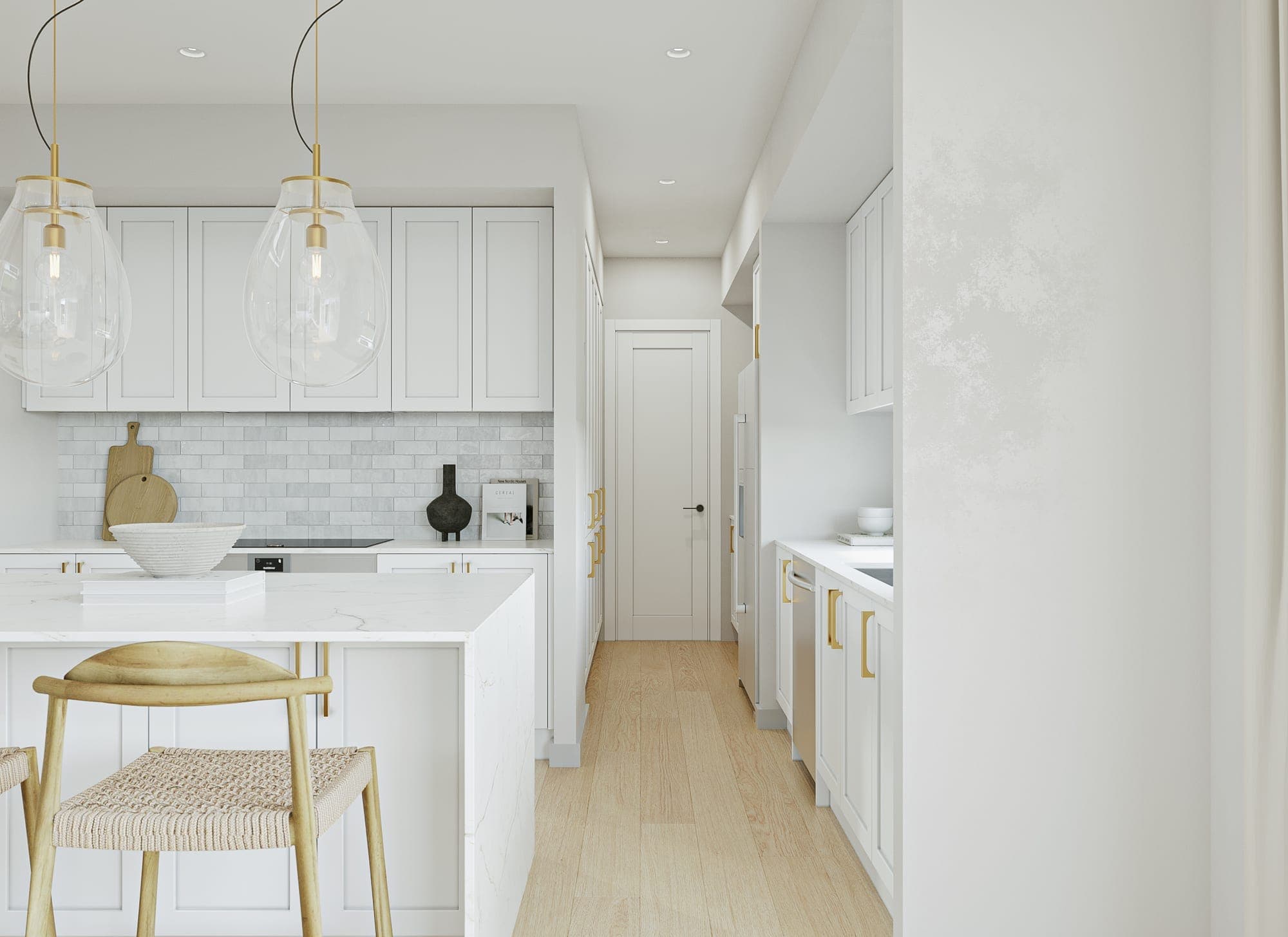Shaker kitchen with a stone island, subway-tiled splashback, brass handles and a butler's pantry beyond