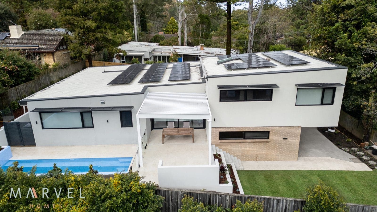 A recent Marvel Homes build set into a leafy, sloping North Shore garden
