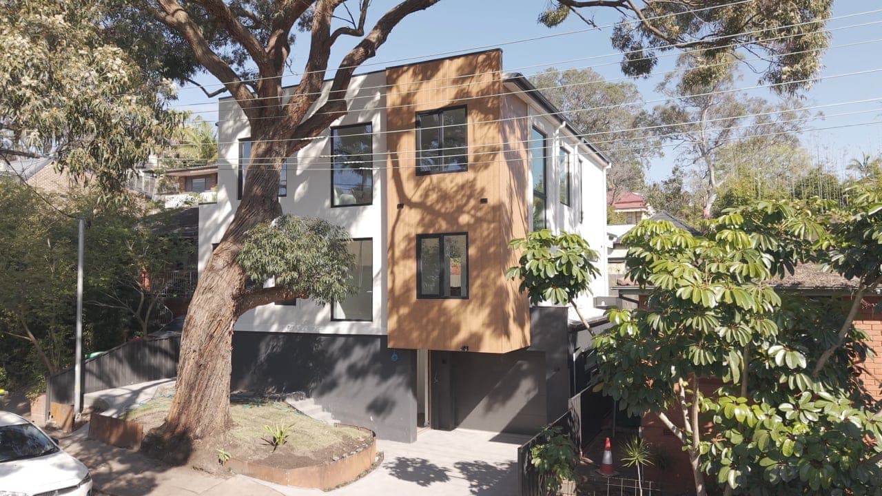 Lilyfield passive house facade, timber and render with established gum tree